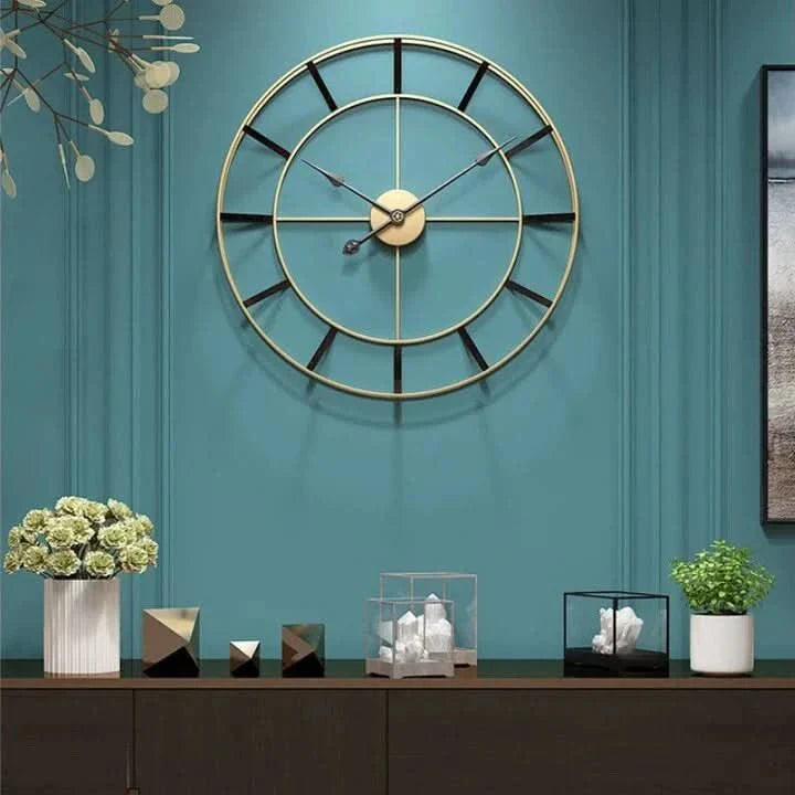 Wall clock with a gold metal frame