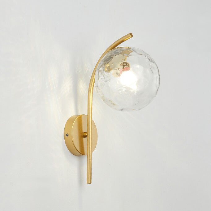 Wall lamp with a spherical shade