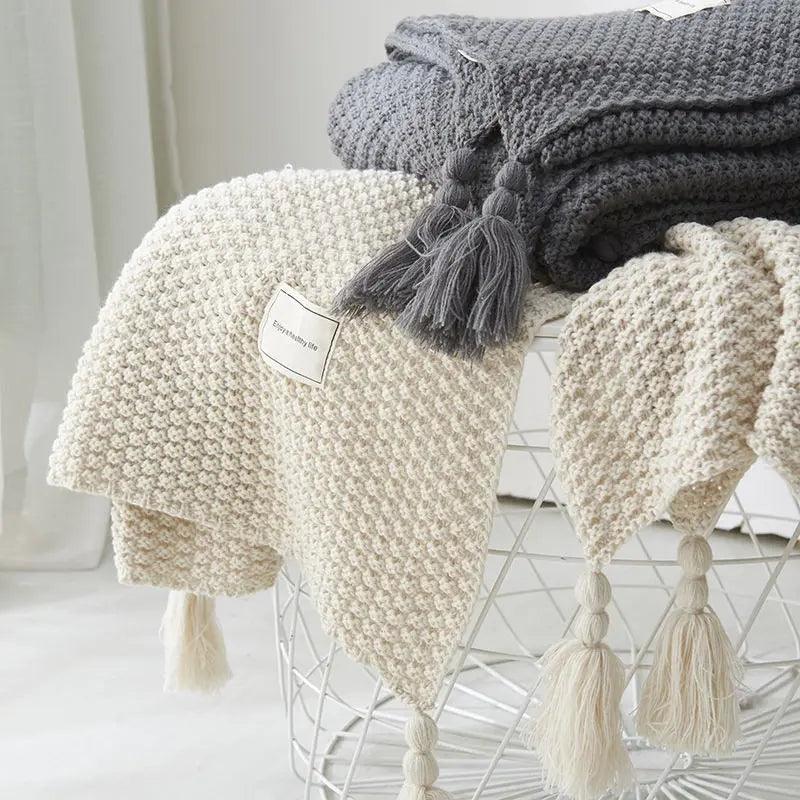 Plaid tricoté à franges
