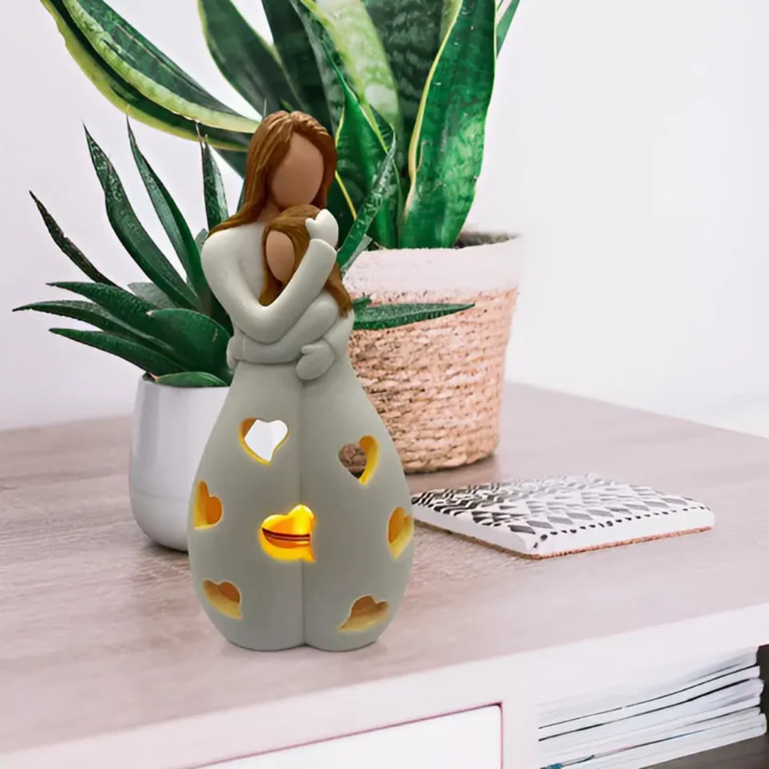 Dekoracyjna rzeźba świecznik z motywem obejmujących się postaci do wnętrz