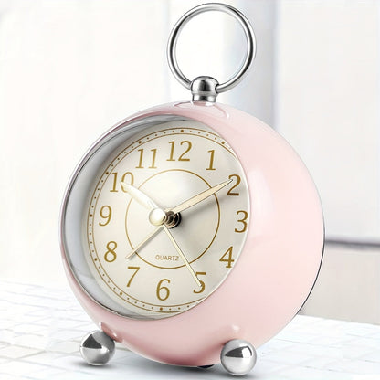 Round travel alarm clock with a light