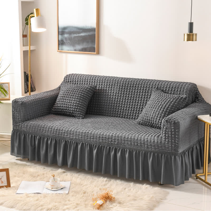 Sofa cover with a ruffle