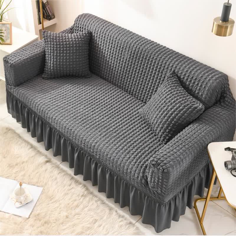 Sofa cover with a ruffle