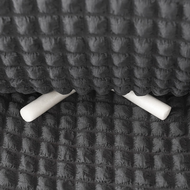 Sofa cover with a ruffle