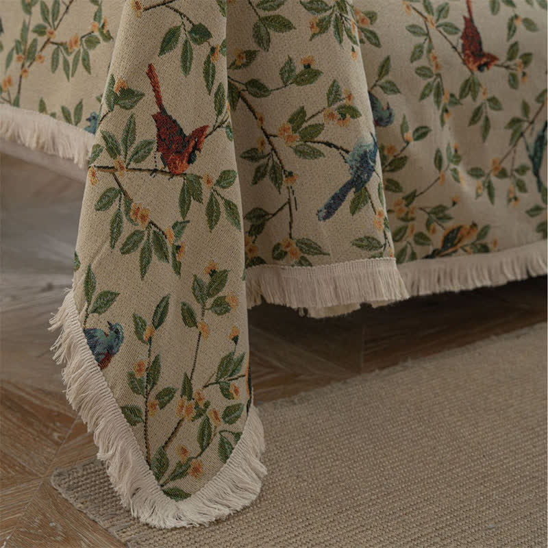 Housse de canapé avec des fleurs et des oiseaux