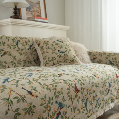 Housse de canapé avec des fleurs et des oiseaux