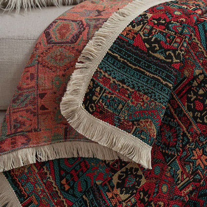 Ethnic sofa cover with tassels