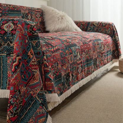 Ethnic sofa cover with tassels