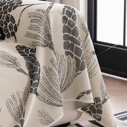Sofa cover with pinecones