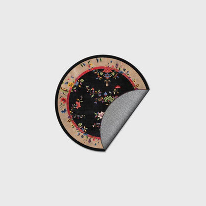 Round floral rug on a black background
