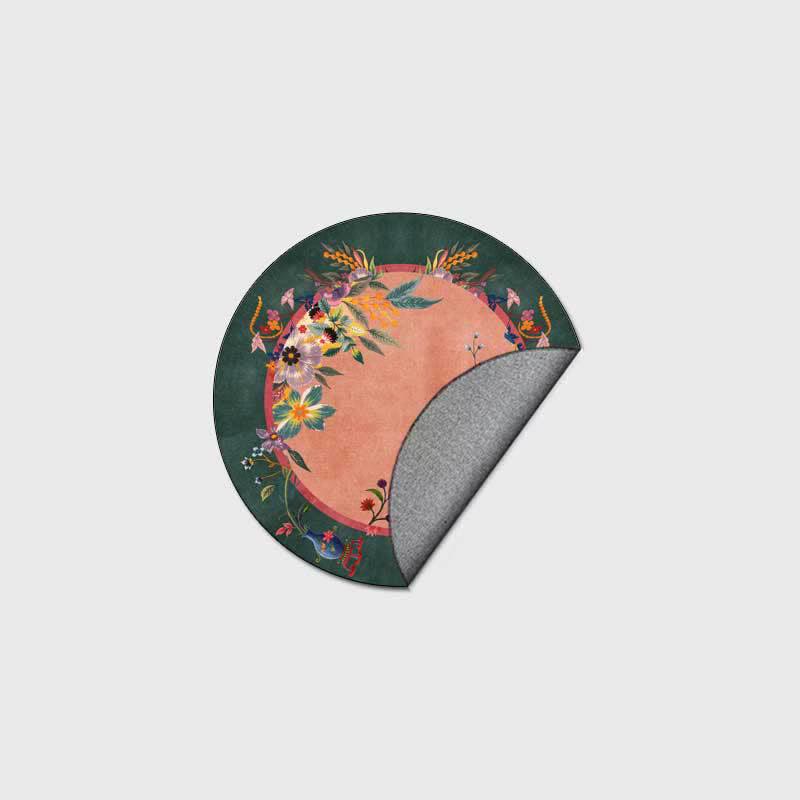 Round floral rug with a coral accent