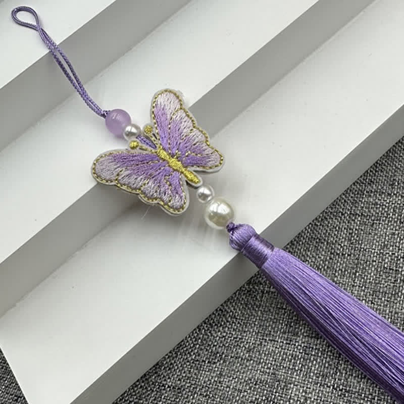 Butterfly and tassel cushion