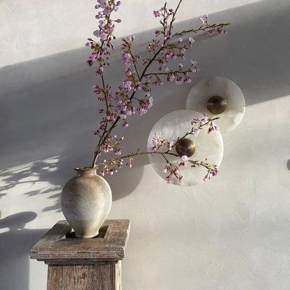 Round alabaster wall lamp