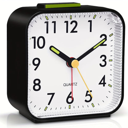 Travel alarm clock with luminous hands