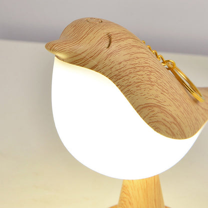 Lampa stołowa LED z motywem ptaka i materiałowym abażurem do wnętrz