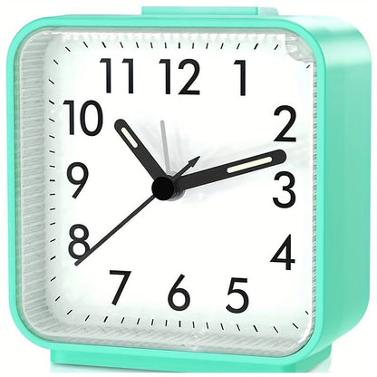 Travel alarm clock with illuminated hands