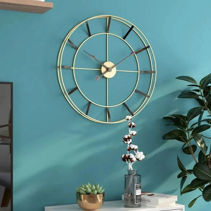 Wall clock with a gold metal frame