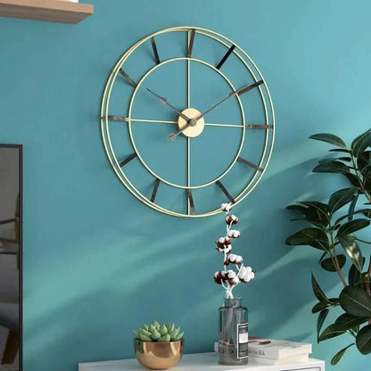Wall clock with a gold metal frame