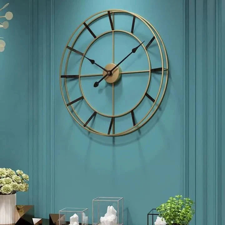 Wall clock with a gold metal frame