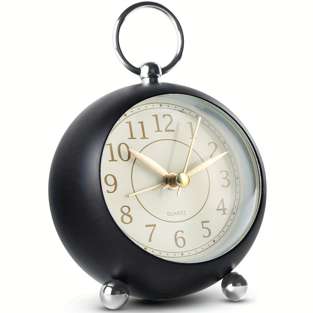 Round travel alarm clock with a light