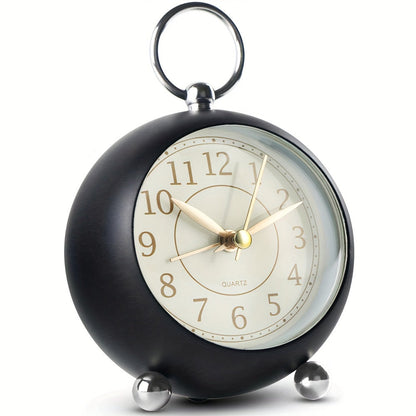 Round travel alarm clock with a light