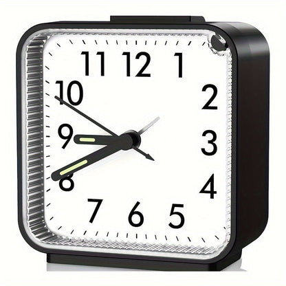 Travel alarm clock with illuminated hands