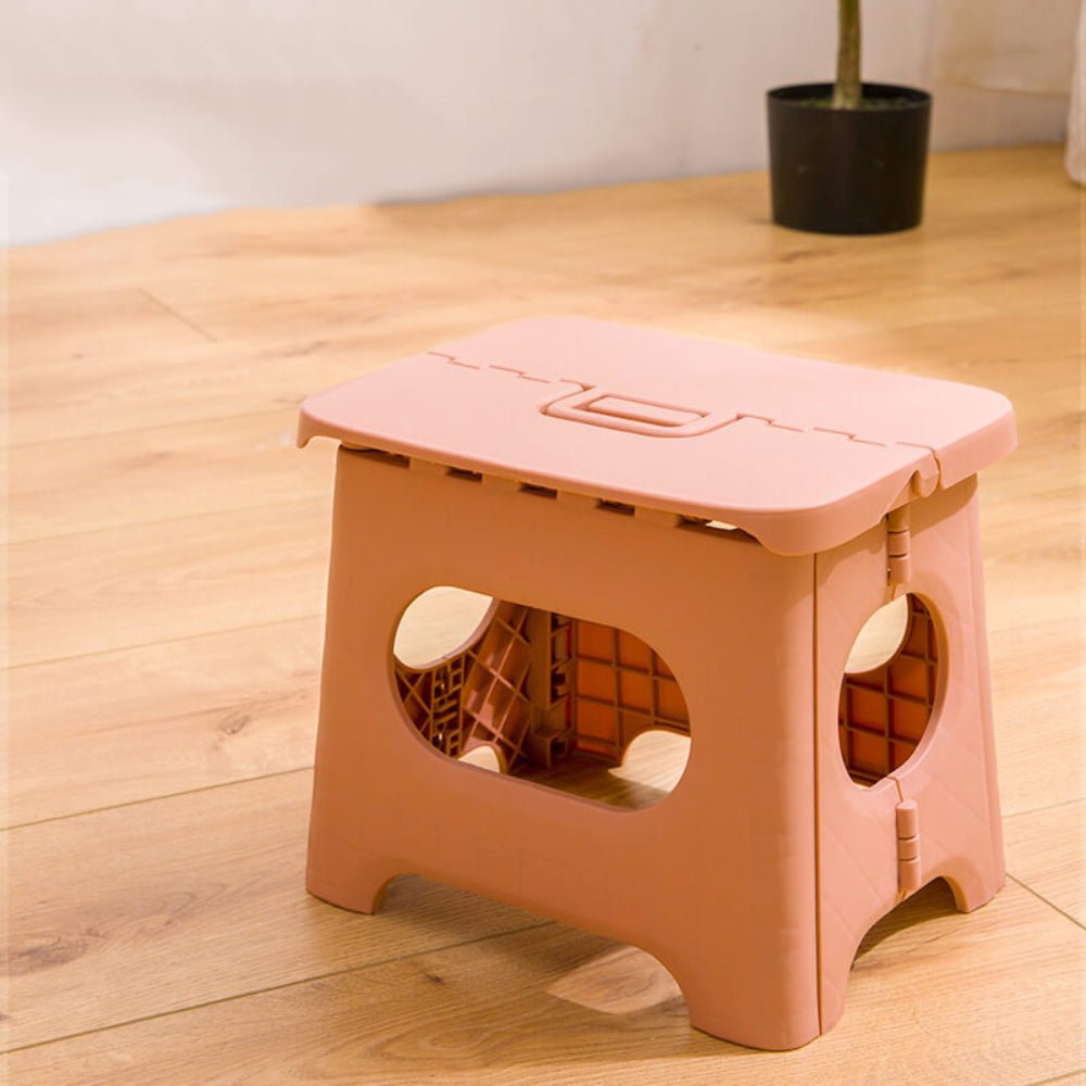 Folding stool with a handle
