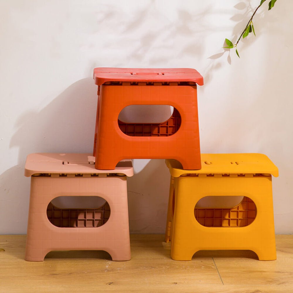 Folding stool with a handle
