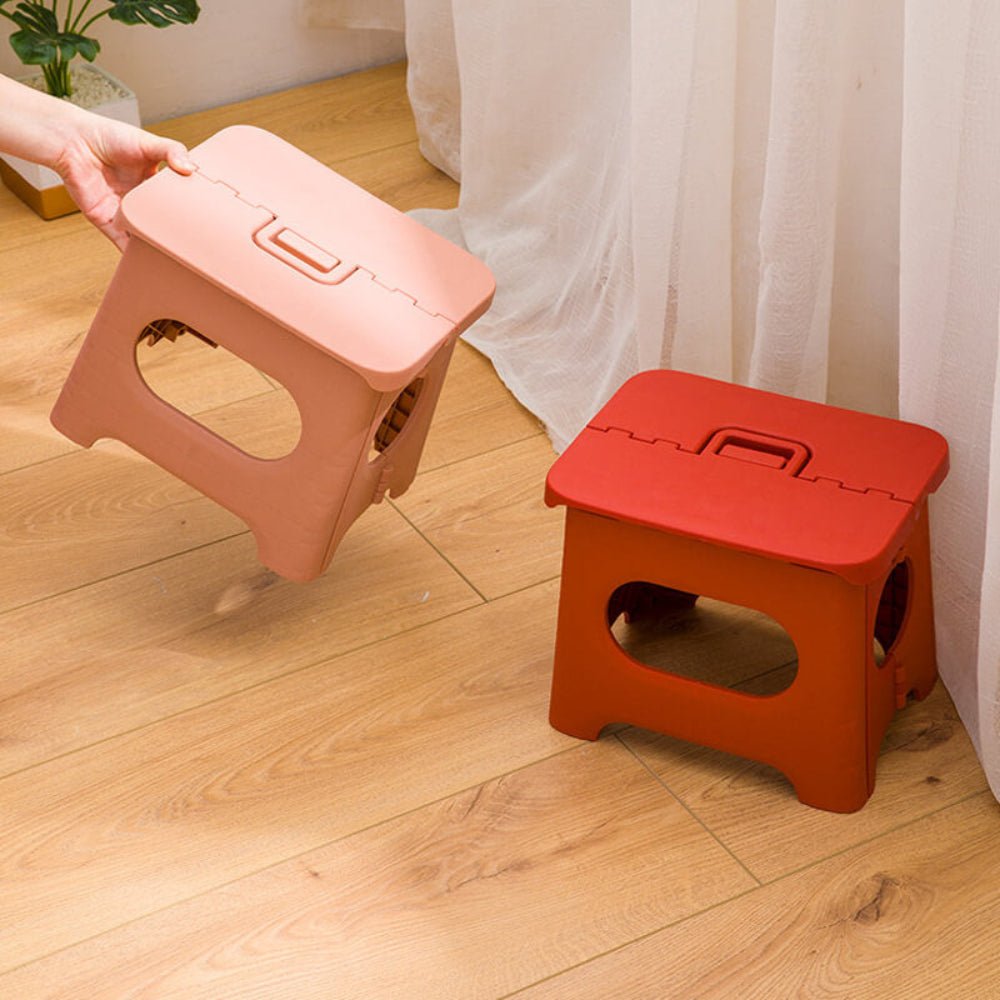 Folding stool with a handle