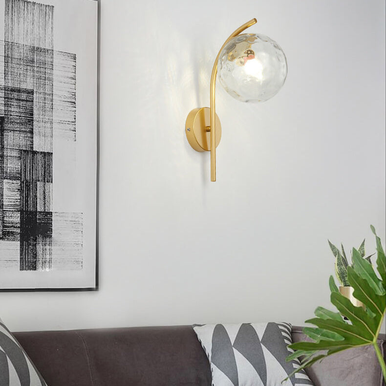 Wall lamp with a spherical shade