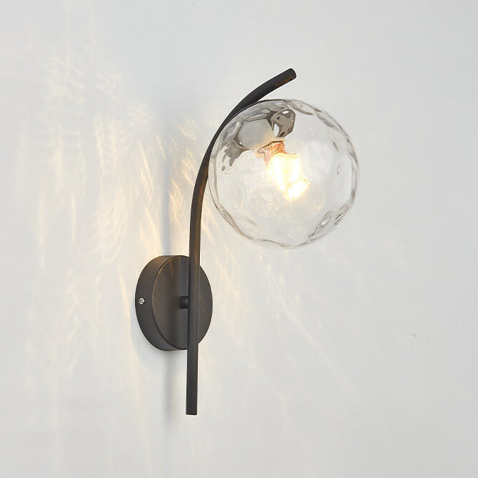 Wall lamp with a spherical shade