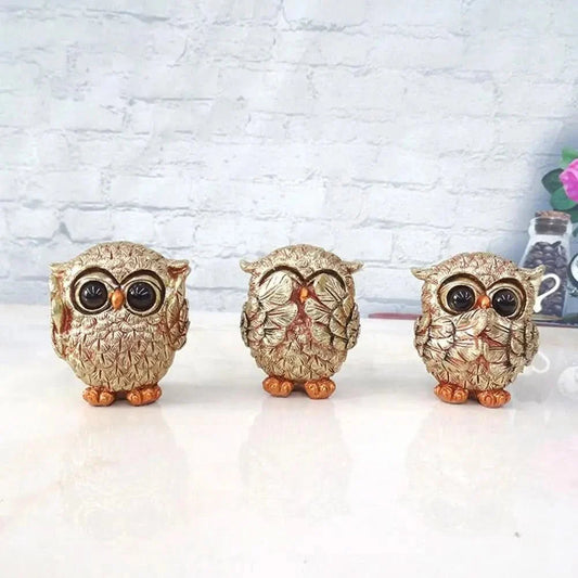 Antique gold owl figurine