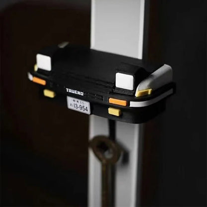 Key holder shaped like a spotlight