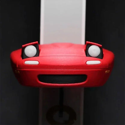 Key holder shaped like a spotlight