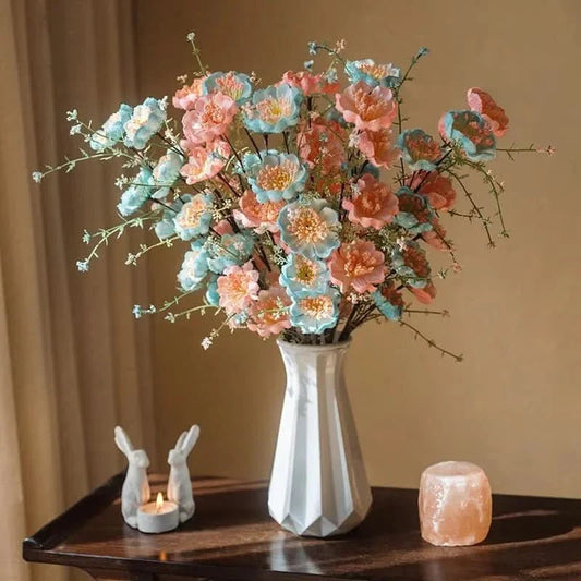 Bouquet artificiel de rhododendrons avec vase