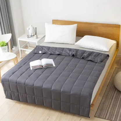 Weighted blanket with glass beads