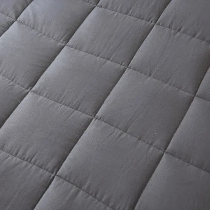 Weighted blanket with glass beads