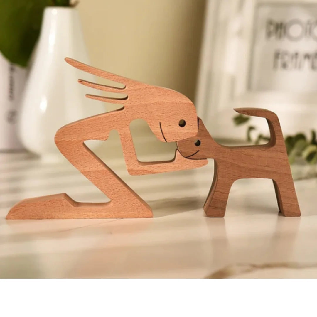 Dřevěná figurka psa a jeho majitele