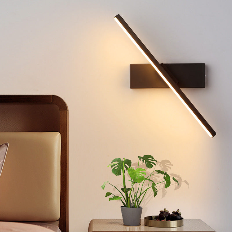 LED wall light with a swiveling arm
