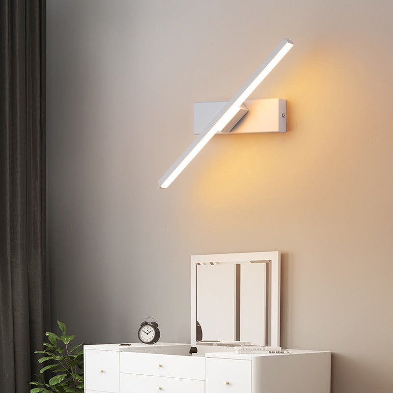 LED wall light with a swiveling arm