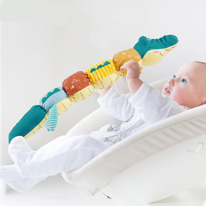 Crocodile sensoriel en peluche