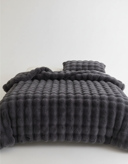 Plush blanket with a soft surface