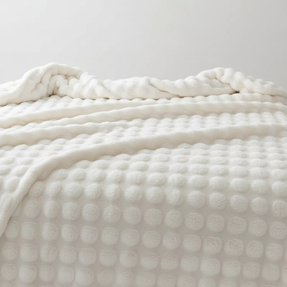 Plush blanket with a soft surface