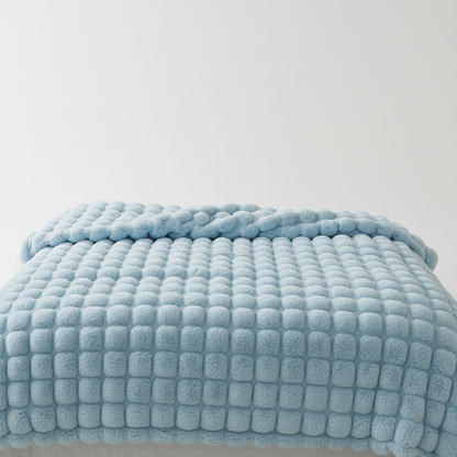 Plush blanket with a soft surface