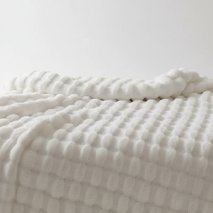 Plush blanket with a soft surface