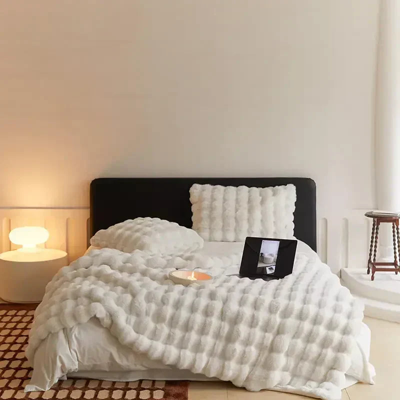 Plush blanket with a soft surface