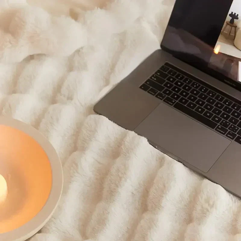 Plush blanket with a soft surface