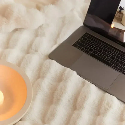 Plush blanket with a soft surface