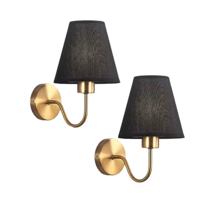 Wall light with a lampshade and gold arm