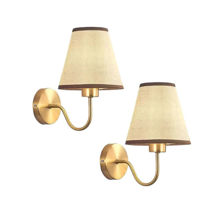Wall light with a lampshade and gold arm